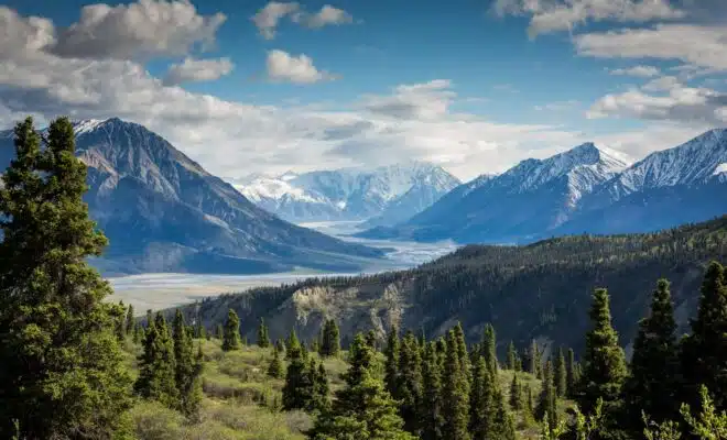 green mountain across body of water